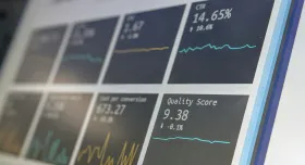 Computer screen showing dashboard of cards with data graphs. Credit to Stephen Dawson on Unsplash.com