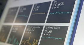 Computer screen showing dashboard of cards with data graphs. Credit to Stephen Dawson on Unsplash.com